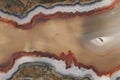 Texture of a large polished agate stone of chalcedony close-up in section cut Royalty Free Stock Photo