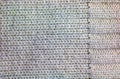 The texture of a large knit sweater or scarf. Knitted background with a relief pattern. Wool hand or machine knitting. Fabric Royalty Free Stock Photo