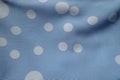 Texture of blue rayon fabric with polka dot pattern