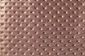 Texture of light brown leather background with capitone pattern, macro Royalty Free Stock Photo