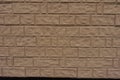 Texture of brown painted brick veneer wall Royalty Free Stock Photo