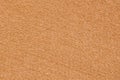 The texture of light orange felt background. Royalty Free Stock Photo