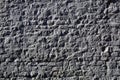 Texture of lined stones with a corrugated uneven surface