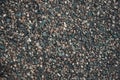 Texture of little rocks. Gravel texture. Small stones, little rocks, pebbles in many shades of grey, white, brown, yellow colour. Royalty Free Stock Photo