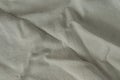 Texture of lused ight gray organic linen fabric closeup