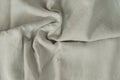 Texture of lused ight gray organic linen fabric closeup