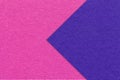Texture of magenta paper background, half two colors with navy blue arrow, macro. Craft purple cardboard Royalty Free Stock Photo