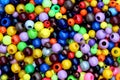 The texture of many bright multicolored beads for needlework. Royalty Free Stock Photo