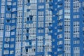 Texture of many windows on the wall of a tall building Royalty Free Stock Photo