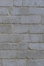 The texture of the masonry walls of cinder blocks. Slightly pink shade of stone. Vertical Format Royalty Free Stock Photo