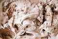 Texture of melting chocolate ice cream. Brown background