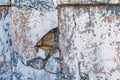 Texture of messy old cracked stone or cement wall in the sunlight for pattern, background. Cracked concrete wall as background. Royalty Free Stock Photo