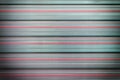 Texture of the metal corrugated fence. Background with parallel horizontal stripes. The wall is gray and pink. Photo Royalty Free Stock Photo