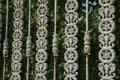 Texture of metal from gray rods in a forged pattern and a grid on a fence Royalty Free Stock Photo