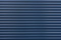 The texture of a metal roller of different colors. The background of the iron blinds. Protective roller shutters for entrance door Royalty Free Stock Photo