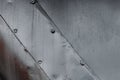 Texture of metal surface, metal worn background with rivets