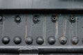 Texture of metal surface, metal worn background with rivets