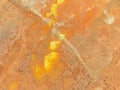 Texture, metallic piece of metal covered with rust. sheet of corrosive material. yellow spots of rust on the sheet