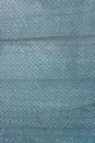 Texture of monophonic tissue, small network. Mesh fabric. Unusual background. Royalty Free Stock Photo