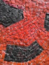 The texture of the mosaic lined with red smalt with black smalt spots Royalty Free Stock Photo