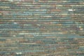 Texture of a multi-colored wall of bricks