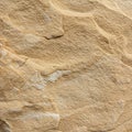 Texture of a natural sandstone surface, characterized by its rough, granular feel. The Royalty Free Stock Photo