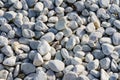 The texture of natural sea pebbles, white rounded stones