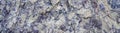 Texture of natural stone rock, background wallpaper white, blue and violet blotches on the surface. Horizontal Royalty Free Stock Photo