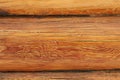 Texture of natural wood close up. New log house. Yellow lacquered wood Royalty Free Stock Photo