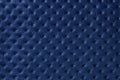 Texture of navy blue leather background with capitone pattern, macro