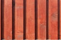 The texture of the new brown-red wooden fence in the rays of sunlight Royalty Free Stock Photo