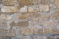 Texture of an old and ancient stone wall closeup Royalty Free Stock Photo