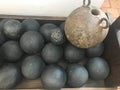 Texture of old antique combat round gray metallic, iron, stone cannon balls, ammunition. The background Royalty Free Stock Photo