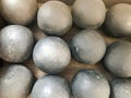 Texture of old antique combat round gray metallic, iron, stone cannon balls, ammunition. The background Royalty Free Stock Photo