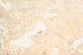 Texture of the old antique wall of yellow-sand color, there are fractures of the white protective layer of plaster from the effect Royalty Free Stock Photo