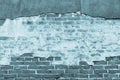 Texture of an old blue brick wall with destroyed plaster Royalty Free Stock Photo