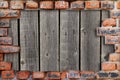 Texture old boards with a superimposed frame of red brick Royalty Free Stock Photo