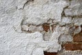 Texture of old brick wall with collapsed plaster. Background of shabby building surface. Destroyed concrete and brick wall Royalty Free Stock Photo
