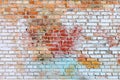 The texture of the old brick wall painted of blue, red, yellow and white colors. Royalty Free Stock Photo