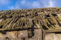 Texture of an old, brown roof tile. Rotten roof.