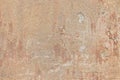 Texture of an old brown wall from shabby stucco and scratched inscriptions Royalty Free Stock Photo