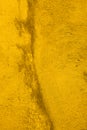 Texture of old concrete wall painted into deep Vibrant warm golden yellow color. Decorative plaster. Abstract design grunge Royalty Free Stock Photo