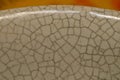 Texture of an old cracked ceramic bowl in closeup, India.