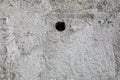 Zagreb, Croatia - February 2021. Texture of an old cracked dilapidated worn wall with a hole in the middle Royalty Free Stock Photo