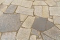 Texture of old cracked gray granite paving slabs Royalty Free Stock Photo