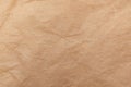 Texture of old crumpled parchment paper. Recycled paper. Kraft packaging material background Royalty Free Stock Photo