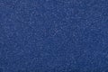 Texture of old dark navy blue paper closeup. Structure of a dense cardboard. The denim background Royalty Free Stock Photo