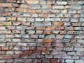 Texture of old dilapidated shabby red brick masonry of red brick wall foreground closeup Royalty Free Stock Photo