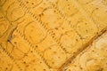 Texture of old yellow foam rubber with traces of springs Royalty Free Stock Photo
