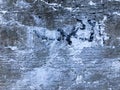 Texture of the old gray concrete cement plaster wall with cracks dent holes patterns and divorces, breakaway pieces, background. Royalty Free Stock Photo